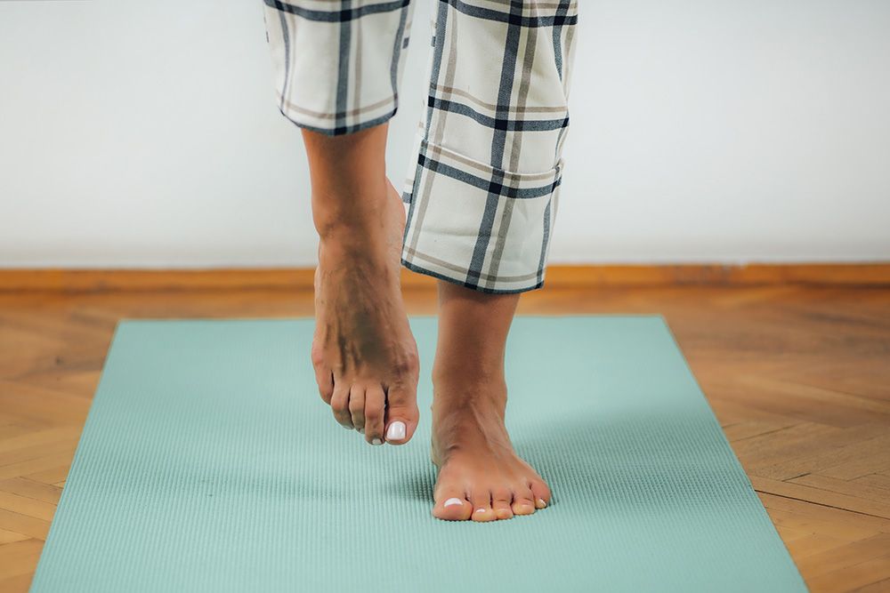 person standing on one foot to test balance